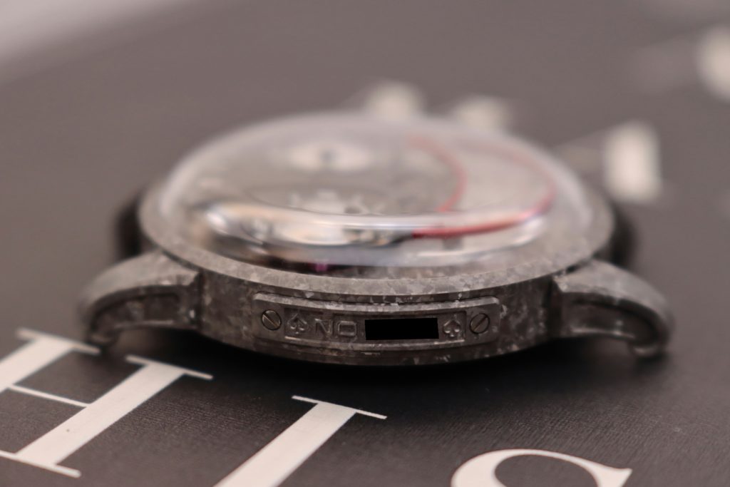 Side view of the Constantine ice crystal titanium watch, highlighting its smooth curves and high-quality material.