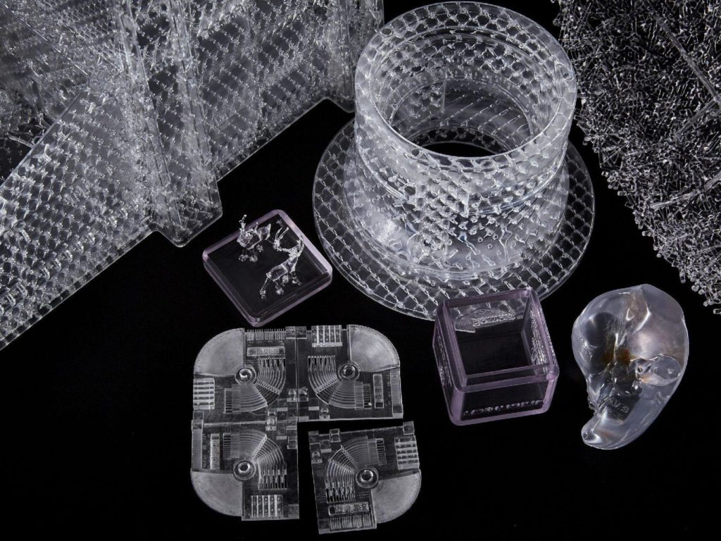 A 3D printer creating a complex geometric prototype layer by layer.