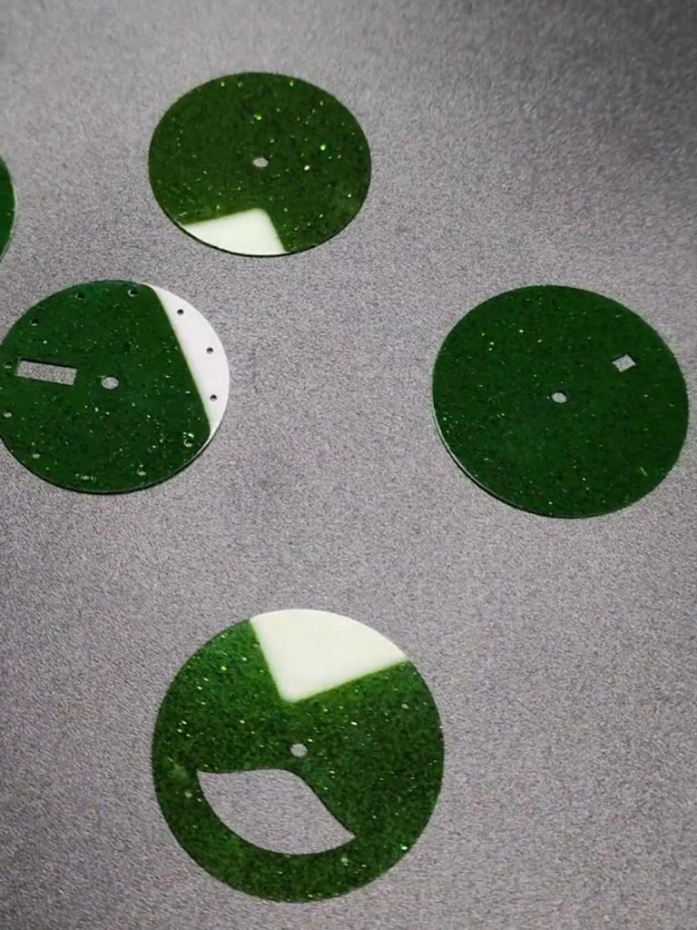 Green Goldstone with reflective sparkles on a dark green base.