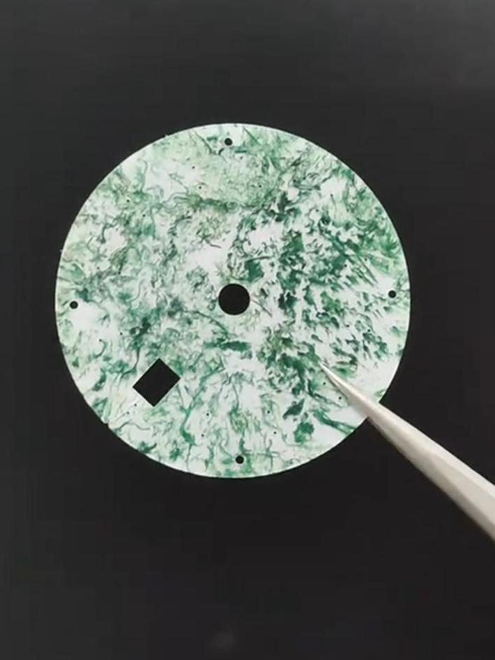 Moss Agate with green moss-like inclusions inside clear quartz.