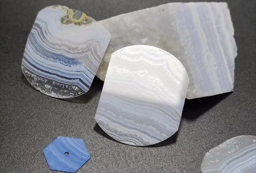 Blue Lace Agate gemstone with delicate light blue and white bands.